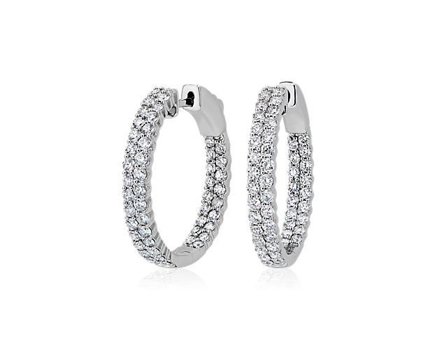 Bring breathtaking sparkle to your look with these stately oval hoop earrings featuring 1 3/4 ct. tw. of diamonds set in dual rows that catch the light for brilliant effect. The 14k white gold design complements the stones with its cool, luxurious gleam. Diameter of hoop measures 1 Inch.