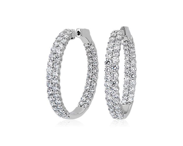Complete your look with timeless sophistication when you slip on these elegant eternity hoop earrings featuring a graceful round shape crafted from 14k white gold. A brilliant 5 ct. tw. of diamonds are set in dual rows to emphasize their brilliant sparkle. Diameter of hoop measures 1 1/4 Inches.