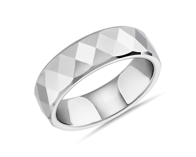 Sleek white tungsten design gives this wedding band an eye-catching gleam. The beautiful flat-edge faceted style features elegant diamond shapes and lends it an elegant, yet rugged look.