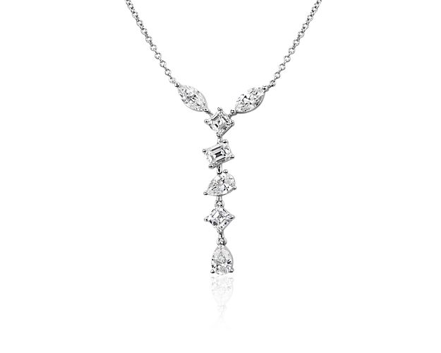 Go for sophisticated style in this delicate dangle necklace featuring cooly lustrous 18k white gold design. Shimmering fancy-shaped diamonds sparkle along the dangling front.