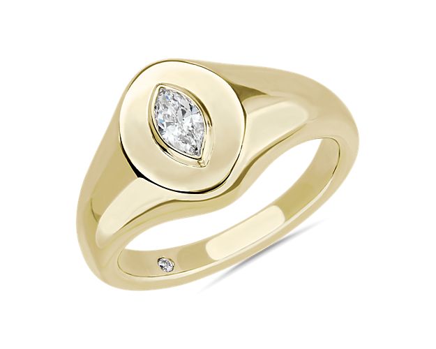 Go for an elegant look with this sleek 14k yellow gold signet ring accenting your pinky finger.  The marquise diamond adds eye-catching brilliance and intrigue.