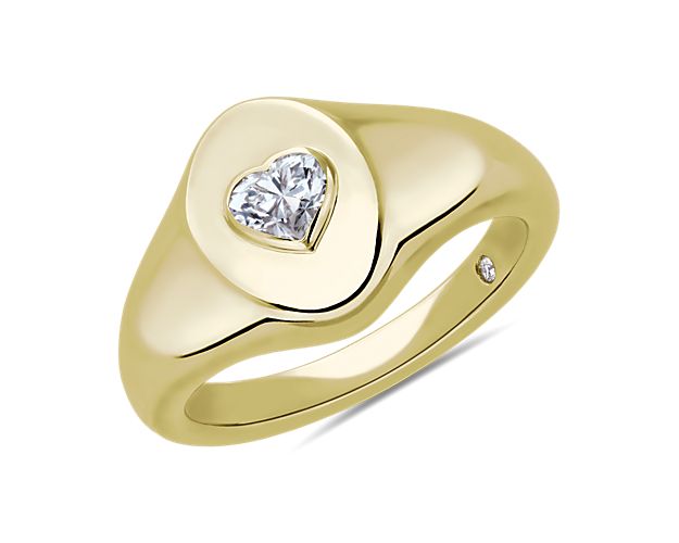 Go for an elegant look with this sleek 14k yellow gold signet ring accenting your pinky finger. The heart diamond adds eye-catching brilliance and intrigue.