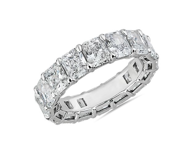 Gleaming platinum showcases a continuous loop of radiant-cut diamonds, bringing timeless grace and brilliance to this 8 ct. tw. eternity ring.