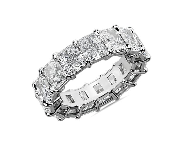 Gleaming platinum showcases a continuous loop of radiant-cut diamonds, bringing timeless grace and brilliance to this 10 1/2 ct. tw. eternity ring.
