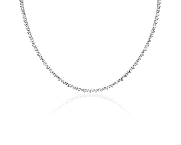 Add luxurious sparkle to your style with this stunning eternity necklace set with diamonds in alternating sizes for an eye-catching pattern. The bright gleam of the 14k white gold cooly complements the stones.