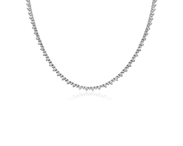 Catch the light when you wear this breathtaking eternity necklace encircled with diamonds that alternate in size to create a mesmerizing design. It is beautifully made of gleaming 14k white gold that ensures lasting quality.