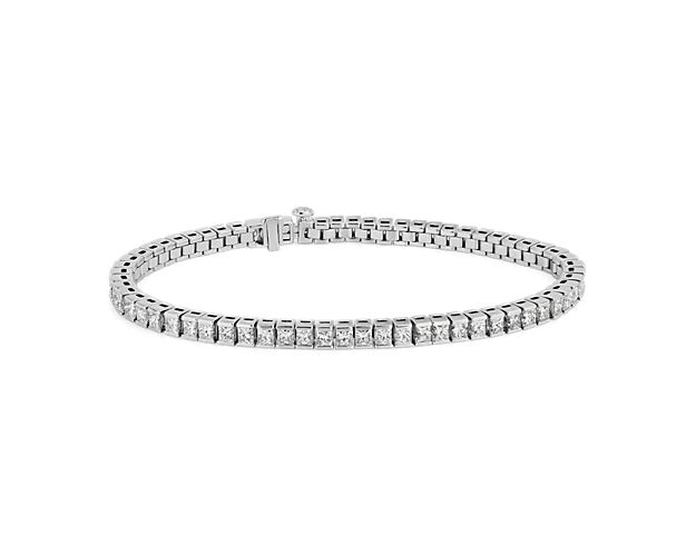 Stunning and sophisticated, this sleek tennis bracelet features a comfortable link design in gleaming 14k white gold. Brilliant princess-cut diamonds lend their sparkle all along its length.