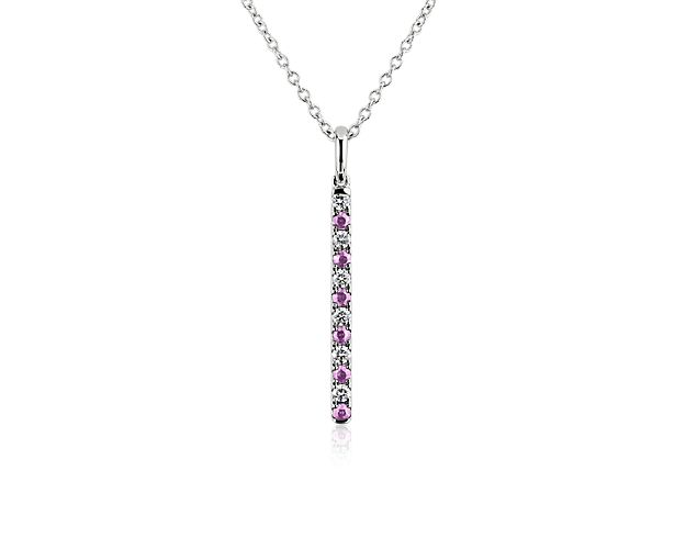 Opt for simply stunning style as you wear this sophisticated vertical bar pendant crafted from luxuriously gleaming 14k white gold. Brilliant diamonds and pink sapphires alternate along its length, adding gorgeous sparkle.