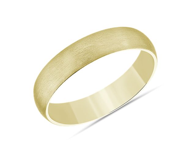 This mid-weight, matte, 14k yellow gold wedding ring has a traditional higher domed exterior profile and a curved inner edge, which makes it extra comfortable for everyday wear.