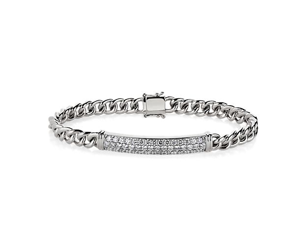 Diamond detail adds brilliant sparkle to this handsome link bracelet. The sturdy links are crafted from 14k white gold and promise a bright gleam as they catch the light.