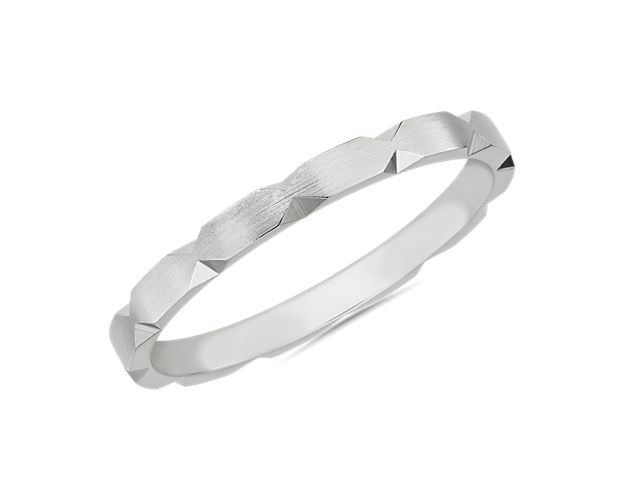 Go for a modern look with this sleek stackable band defined by edgy hexagon-shaped cut detail along the edges. It is crafted from lustrous 14k white gold to ensure timeless quality.
