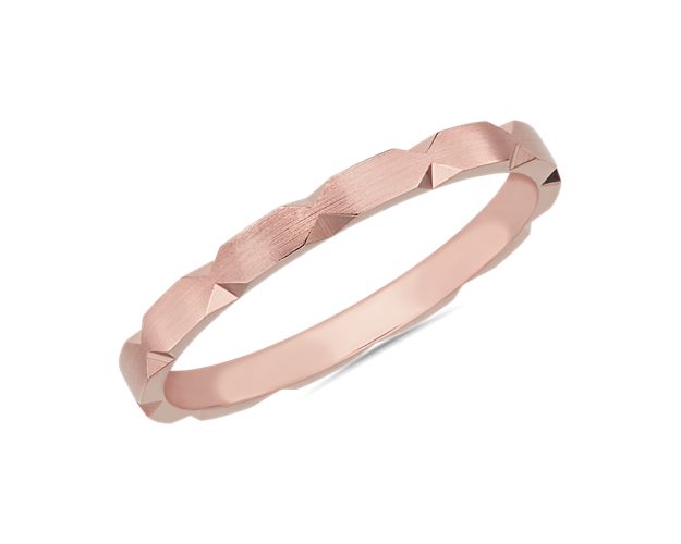 Go for a modern look with this sleek stackable band defined by edgy hexagon-shaped cut detail along the edges. It is crafted from lustrous 14k rose gold to ensure timeless quality.