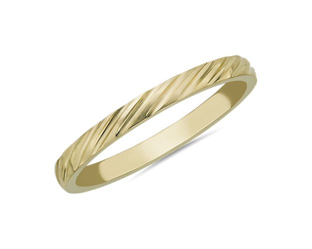 Elegantly angled stripe texturing adds soothing dimension and detail to this sleek stackable band. It boasts gleaming 14k yellow gold design for enduring quality.