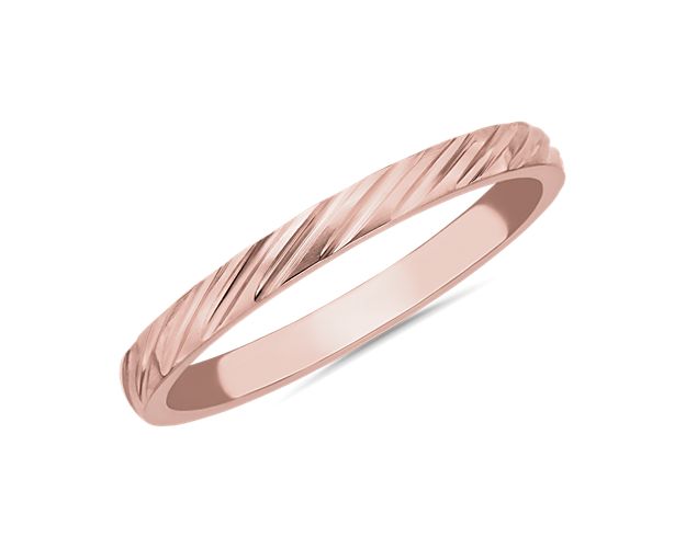 Elegantly angled stripe texturing adds soothing dimension and detail to this sleek stackable band. It boasts gleaming 14k rose gold design for enduring quality.