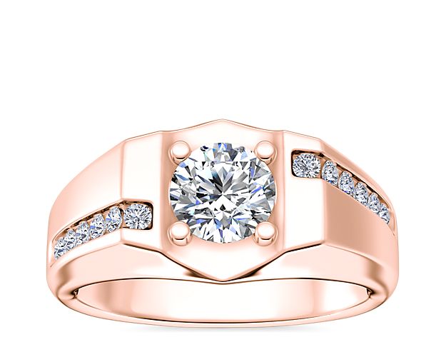 Crafted from gleaming 14k rose gold, this men's engagement ring can be set with your chosen round, cushion, prince, emerald-cut or radiant diamond. It features shimmering bypass channel accent diamonds for bold sparkle.