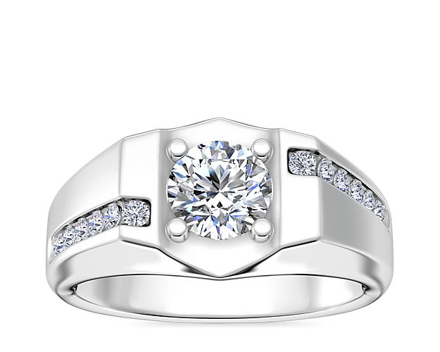 Boasting plenty of sparkle, this engagement ring is ready to hold your chosen round, cushion, princess (prince), emerald-cut, or radiant diamond at the center. The gleaming 18k white gold design features bypass channel-set diamond detail for even more eye-catching detail.