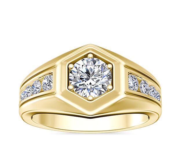 A round-cut diamond sparkles in the hexagon-shaped face of this sophisticated engagement ring. The warmly gleaming 14k yellow gold design is set with brightly sparkling channel-set diamonds for a breath-taking effect.