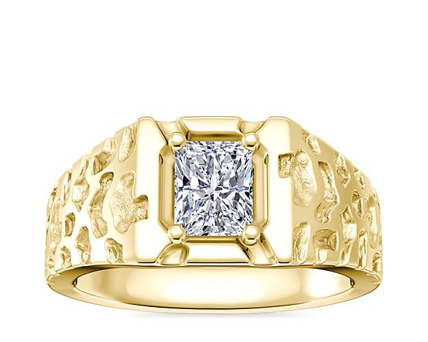 Textured yellow gold men's engagement ring with a radiant diamond