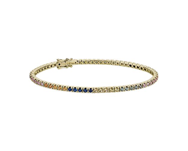 Finish your look with a touch of elegance with this classic 2mm-wide tennis bracelet crafted from 14k yellow gold. It is set with brillantly sparkling multi-colored sapphires.