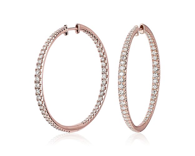These large hoop earrings lend classic sophistication to your style, with the front-facing edges shimmering with gorgeous pave-set diamonds. They are designed in gleaming 14k rose gold for a romantic look of luxury. Diameter of hoop measures 1 1/2 Inches.