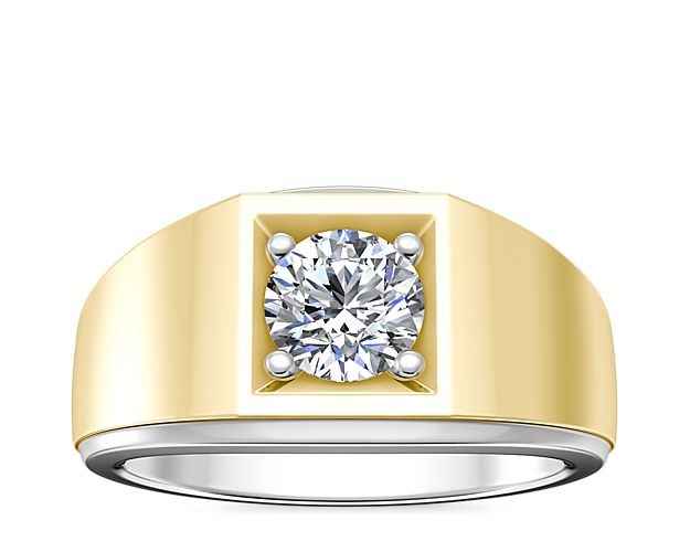 This stunning two-tone engagement ring features gracefully curved lines defining the 14k white and yellow gold design. The solitaire design can be set with a round, princess (prince), emerald-cut, radiant or asscher-cut diamond.