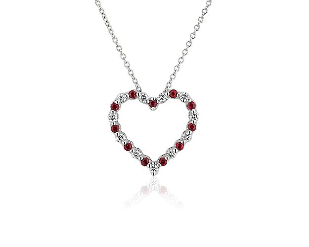 Exude romance and luxury when you wear this heart-shaped pendant gorgeously set with alternating rubies and diamonds for a brilliantly sparkling effect. The floating design is crafted from lustrous 14k white gold for lasting quality.