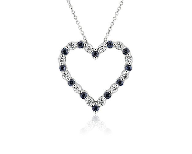 Imbue your style with a dose of dreamy romance with this heart-shaped floating pendant. It is beautifully crafted from luxurious 14k white gold and set with alternating blue sapphires and shimmering diamonds for a breath-taking effect.
