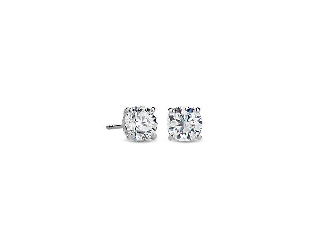 Less is more with the understated accent of these solitaire stud earrings. They're cast with 14k white gold and feature a nature-inspired setting that cradles the two carat diamond.