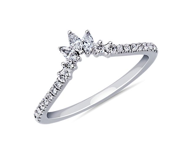Curving 14k white gold meets at the center of this band creating a romantic design. A trio of marquise-shaped diamonds flanked on either side by shimmering pavé diamonds add a dash of moment-making sparkle.