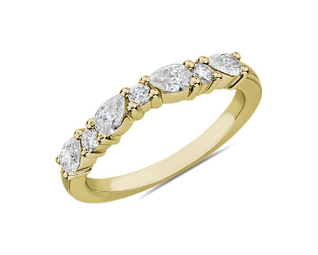 Classic and sophisticated, pear and round-cut diamonds come together to form a row of beautiful sparkle. Set in 14k yellow gold, this romantic band promises glamour to last a lifetime.