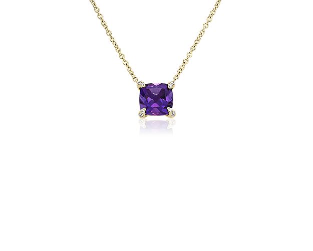 Indulge in a hint of luxury as you wear this pendant featuring a cushion-cut amethyst. Diamond-accented prongs lend this piece elegant sparkle as they hold the main stone in place. 14k yellow gold promises a warm luster that compliments the dramatic purple hue of the amethyst.
