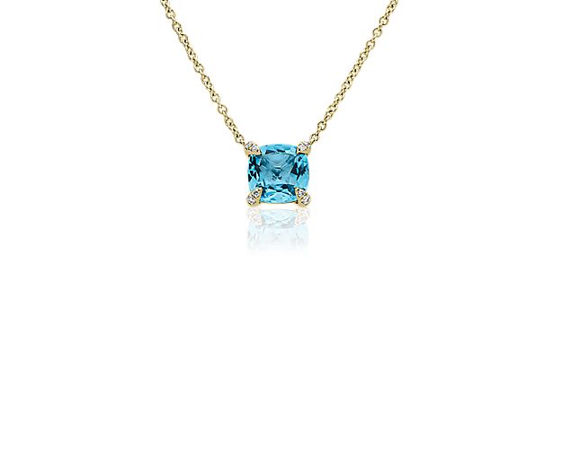 Shimmer through the day with this pendant boasting a dreamy blue cushion-cut Swiss blue topaz that catches the light as you move. The 14k yellow gold design features a luxurious gleam, and sparkling diamonds add a beautiful touch to the prongs around the main stone.
