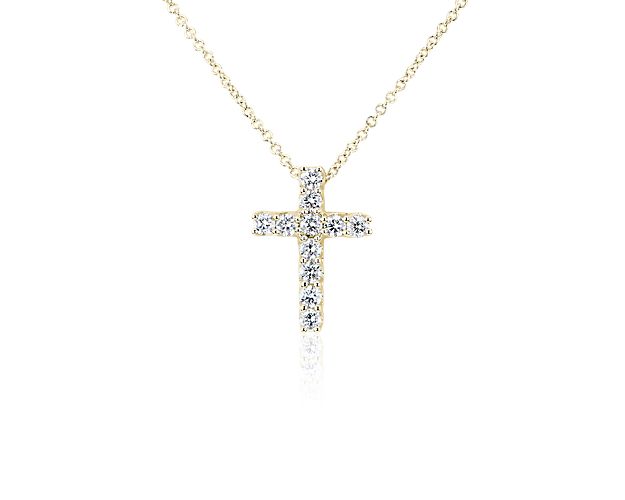 Keep your faith close to your heart with this shimmering cross pendant that's set into 14k yellow gold for a subtle touch of warmth.