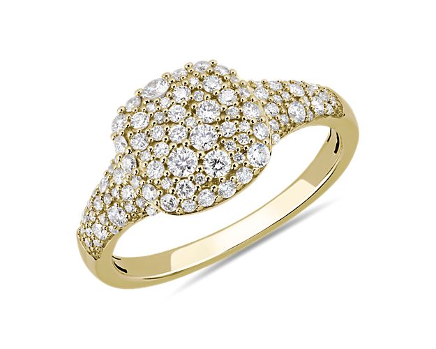 Yellow gold signet ring with diamond clusters.