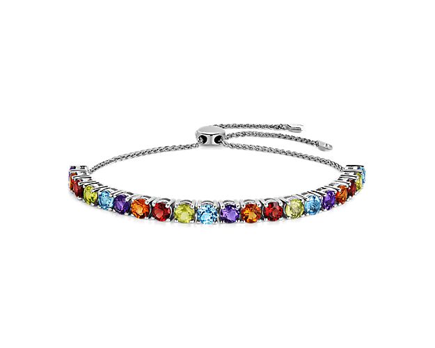 Gorgeously hued stones sparkle from this eye-catching sterling silver bolo bracelet, elevating your style with statement color. The adjustable design keeps it comfortable to slip on and simple to secure.