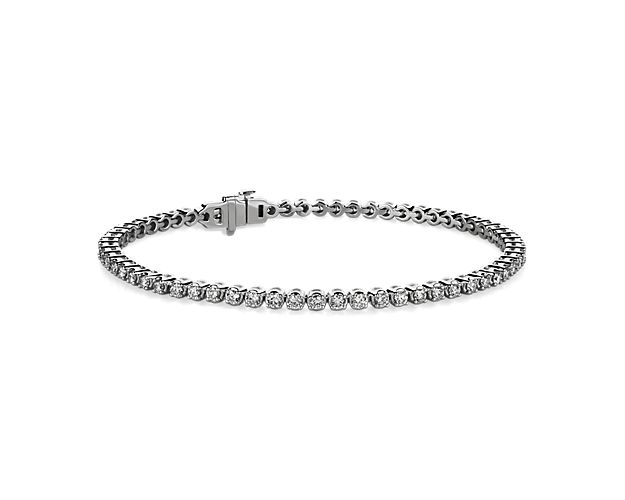 Simple and brilliant, this classic tennis bracelet features round, brilliant lab-grown diamonds framed in 14k white gold.