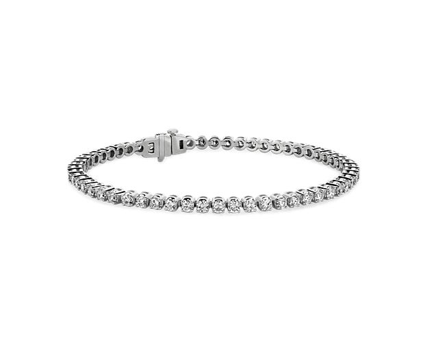 Brilliance defined, this tennis bracelet features brilliant cut round lab-grown diamonds set in a four-prong straight line design of 14k white gold.