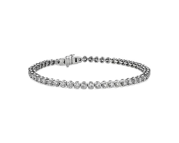Flash some brilliance with this breathtaking tennis bracelet, showcasing dazzling round lab-grown diamonds prong-set in complementing 14k white gold.
