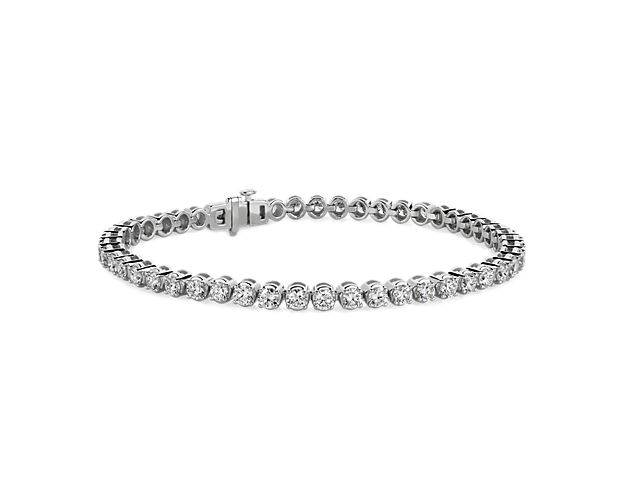 Flash some brilliance with this breathtaking tennis bracelet, showcasing dazzling round lab-grown diamonds prong-set in complementing 14k white gold.