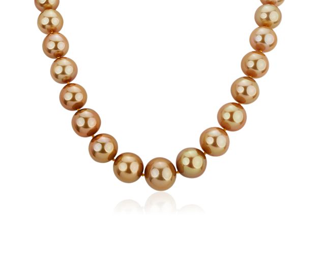 South Sea pearls adorn this sublime necklace that offers gold styling and a subtle crescendo in size.