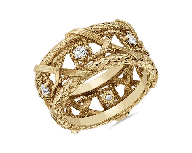The intricately entwining woven basket design of this eternity ring is elegantly crafted in lustrous 18k yellow gold. It is beautifully set with sparkling diamonds for a luxurious finish.