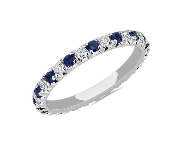 Stunning sapphires are punctuated by brilliant diamonds in this classic French pavé eternity band. Set in 14k white gold, this is the perfect gift for those who appreciate a pop of color.