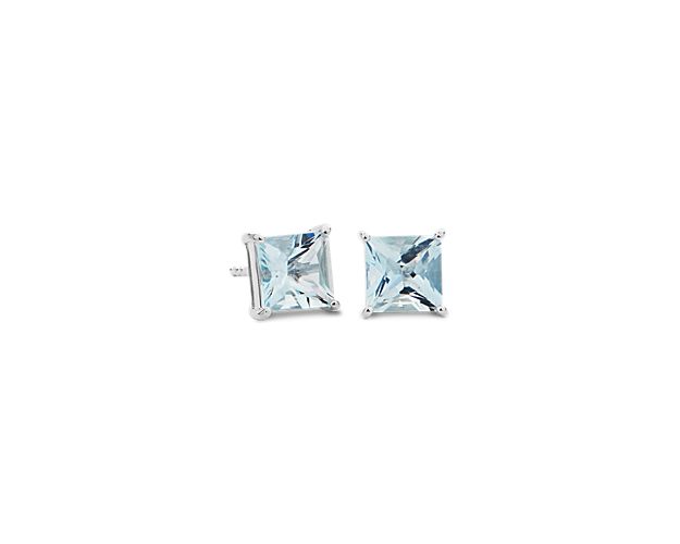 Look lovely with these contemporary stud earrings featuring princess-cut aquamarine stones flaunting dreamy blue hues. They are beautifully crafted from 14k white gold for a look of timeless elegance.