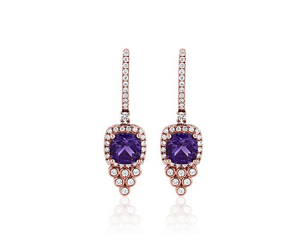 Crafted from lustrous 14k rose gold, these sophisticated drop earrings flaunt beautiful purple amethyst stones. Shimmering diamond drops flow beautifully underneath the main stones.