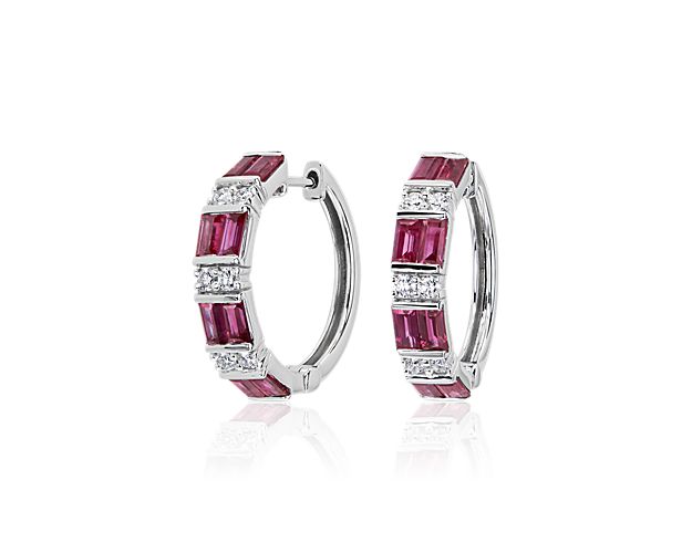 Elevate your look with these gorgeous hoop earrings featuring baguette-cut sapphires and diamonds alternating along the front-facing edge. They are beautifully crafted from luxurious 14k white gold for enduring quality.