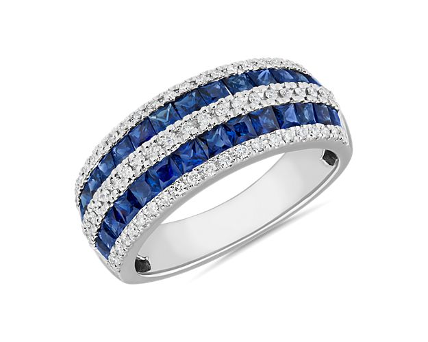 Brilliant blue sapphires and vividly sparkling diamonds are set in luxurious bands in this eye-catching statement ring. 14k white gold design promises a look of enduring luxury and quality.