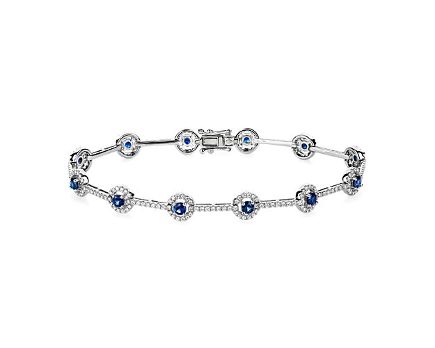 Richly hued sapphires and bright diamonds alternate along the length of this delicately detailed bracelet. The 14k white gold design features a rich lustre and complements the stones.