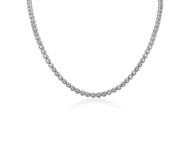 Exude timeless elegance when you wear this eternity necklace beautifully set with 15 carats of diamonds shimmering dramatically in an endless loop. It is made of gleaming white gold that completes the look with luxurious allure.