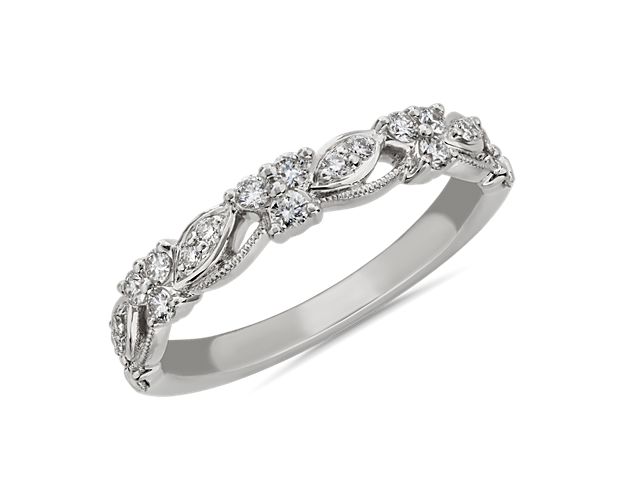Capture the heart with this wedding ring featuring gorgeous round diamonds nestled in breathtaking lace. Milgrain details beautifully accentuate the shank of this elegant 14k white gold design.