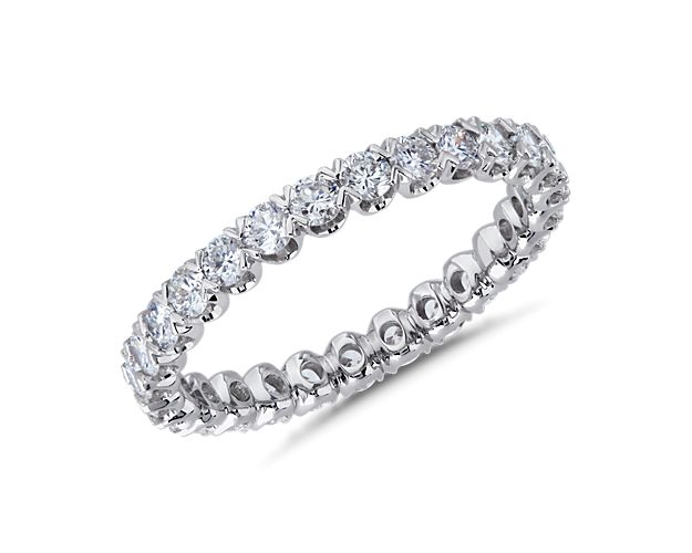 Elegantly romantic, this shimmering eternity ring features a unique v-prong pavé setting holding the diamonds secure. The lustrous gleam of the 14k white gold design speaks of enduring luxury.